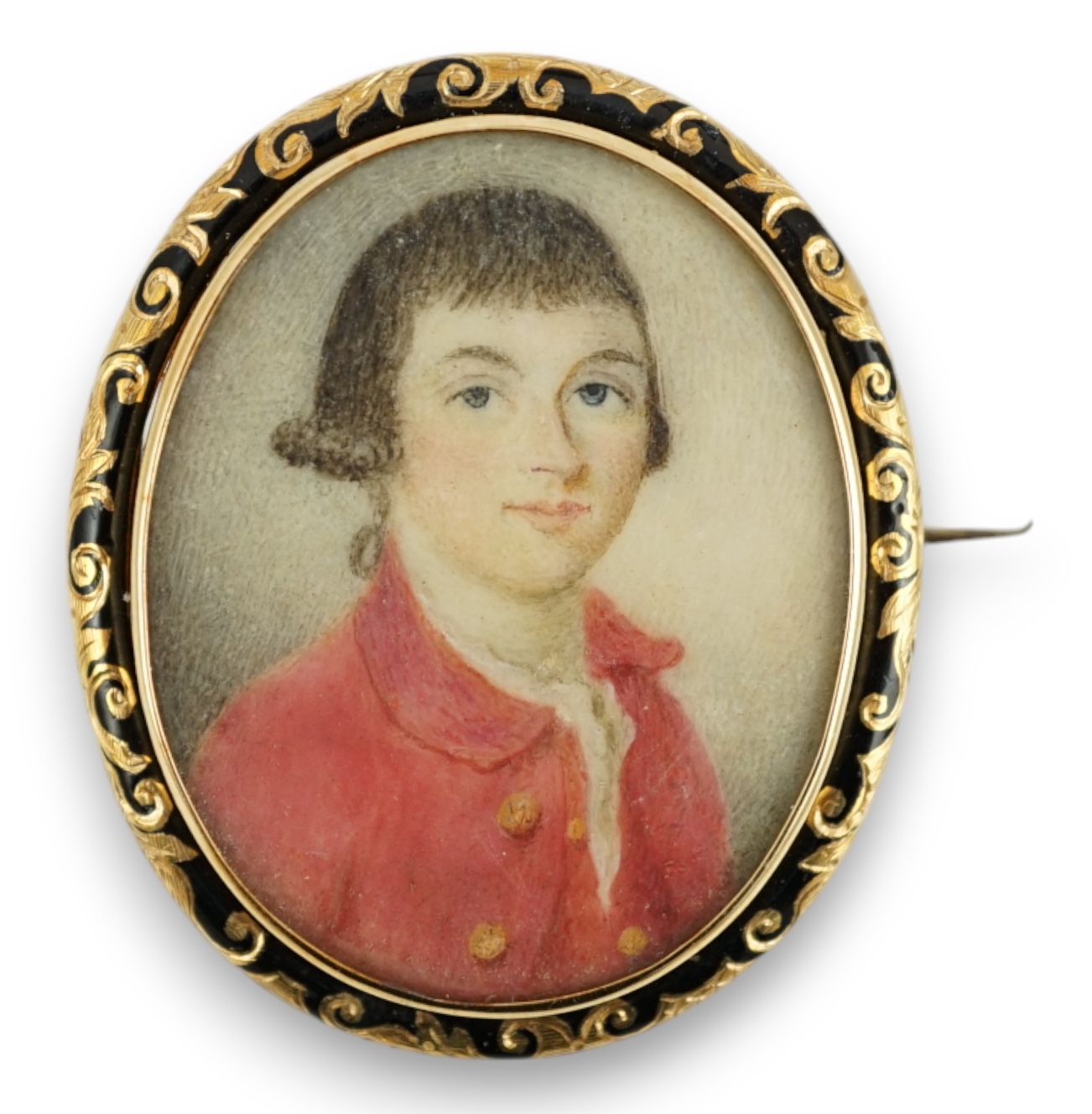 A 19th century yellow metal and black enamel mounted oval portrait miniature of a young gentleman, 42mm.